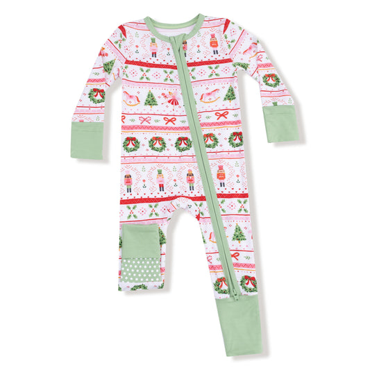 Christmas-themed baby romper with green zipper on a white background