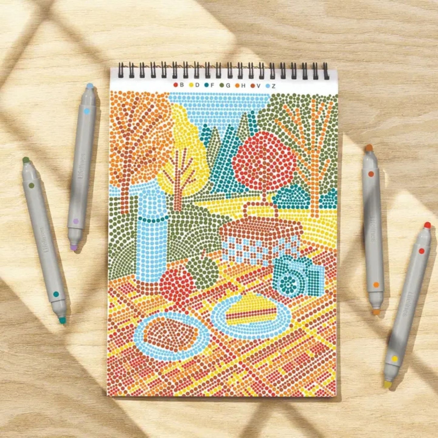 Calming dot-by-letter activity pad with botanical scenes