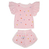 Pink children's outfit with ruffled sleeves and colorful heart patterns on a white background