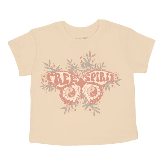 A beige colored boxy tee with a graphic of a butterfly and the text 'FREE SPIRIT' on it.