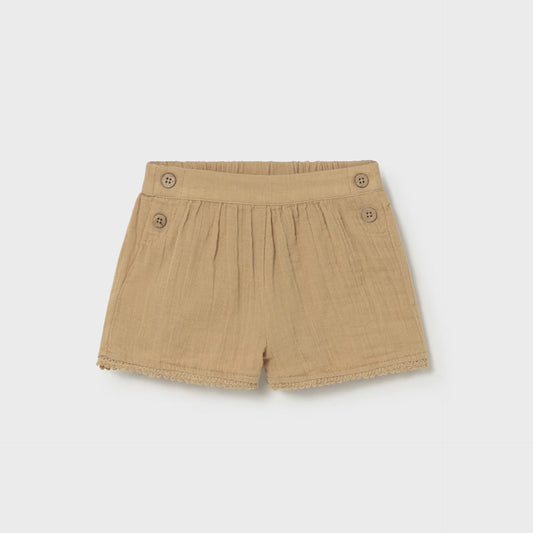 Tan shorts with button details on a white background