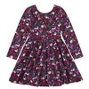A long-sleeve children's dress with a dark purple and black base, covered in a whimsical floral and animal print featuring rabbits, flowers, and butterflies in pink, white, green, and yellow.