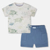 Children's t-shirt with turtle design and blue shorts on a white background