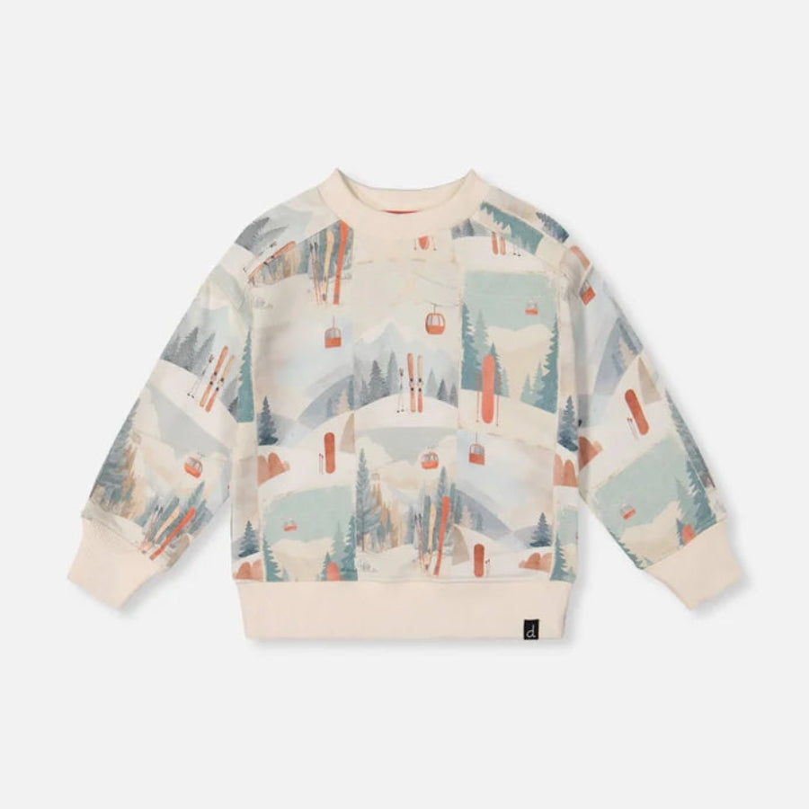A children's long-sleeve crewneck sweatshirt featuring a whimsical winter mountain and ski lift pattern in soft pastel tones of blue, green, orange, and beige, displayed flat against a light gray background.