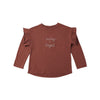 Red long-sleeve top with 'merry & bright' text on a white background