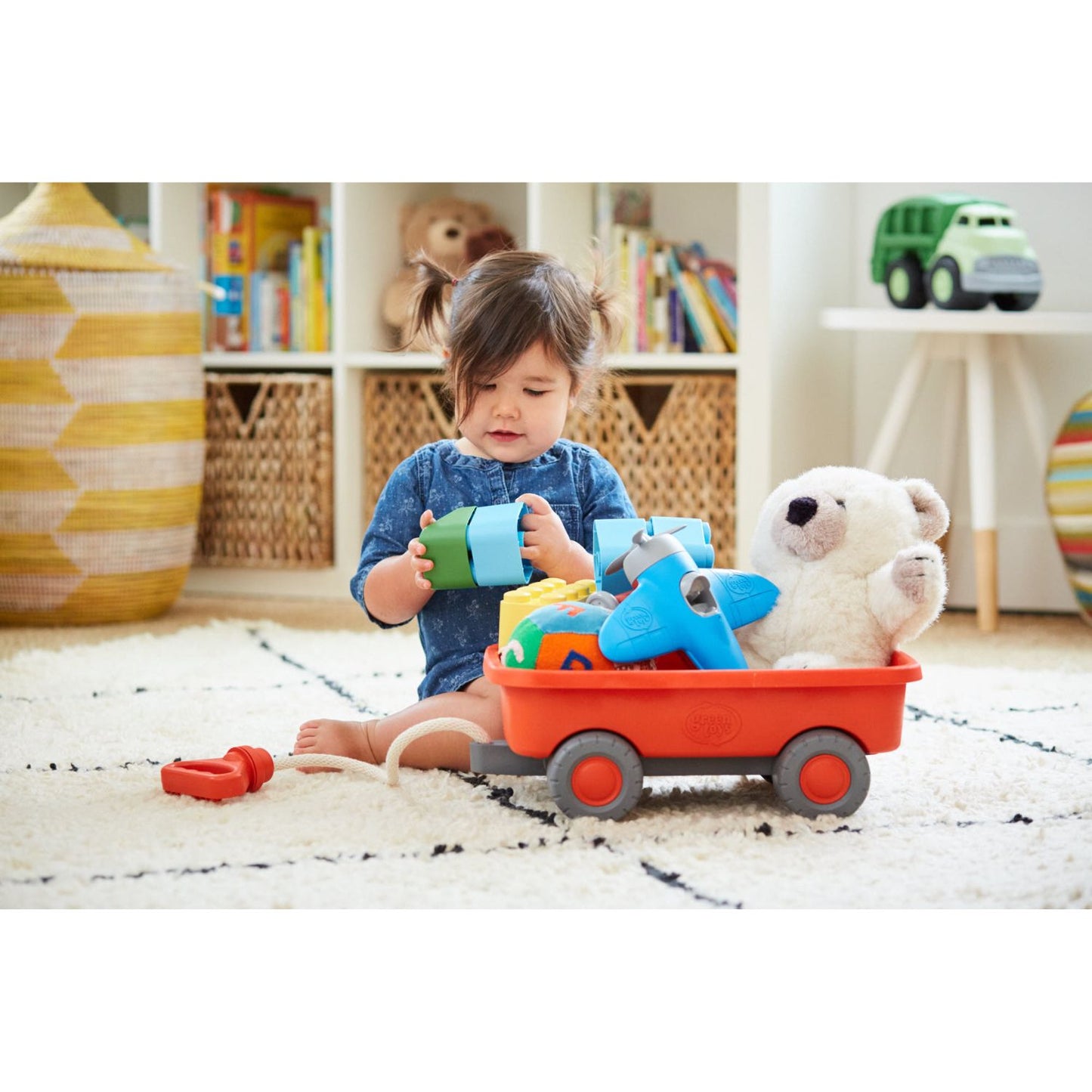 Sturdy recycled-plastic wagon for carrying toys and treasures.