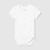 White baby onesie on a light gray background