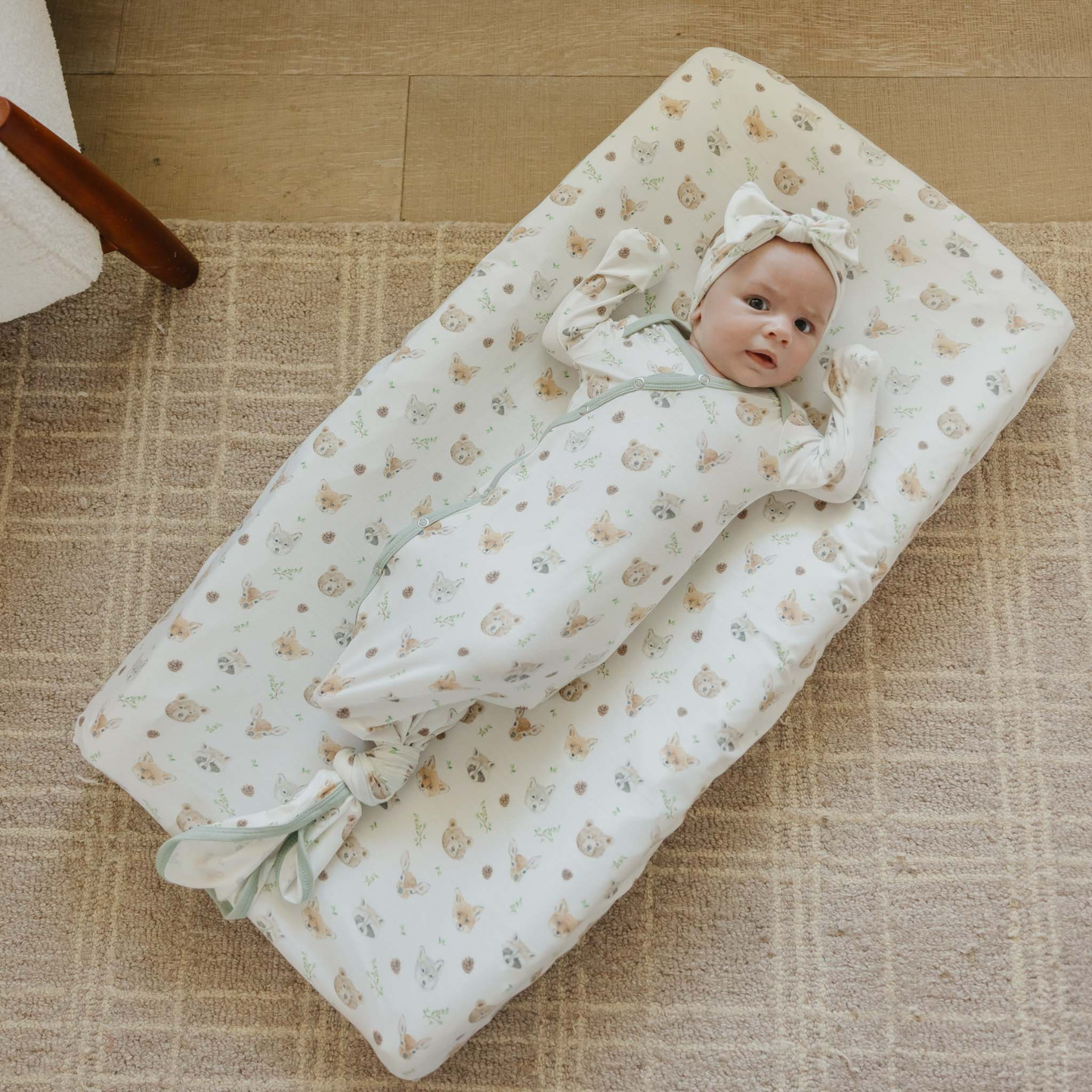 White baby knotted gown with woodland animal prints