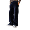 Person wearing a leopard print top and navy pants on a plain background