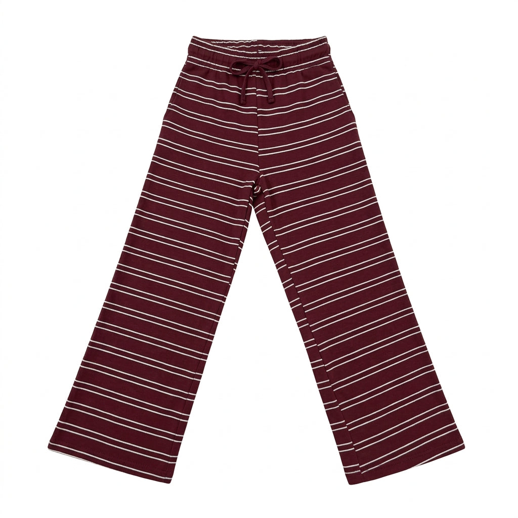A pair of wide-leg knit pants in burgundy with thin white horizontal stripes, laid flat on a glossy white surface.