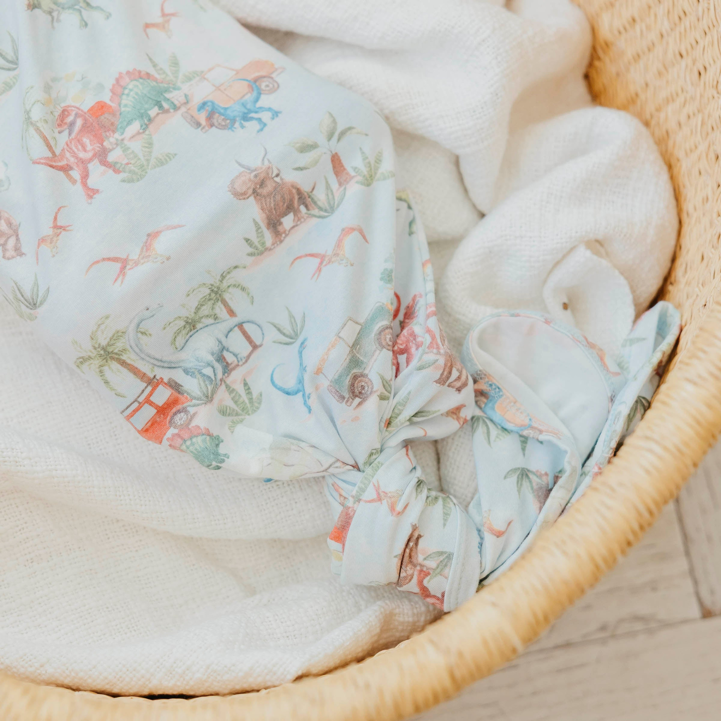 Dinosaur print baby gown with knotted bottom
