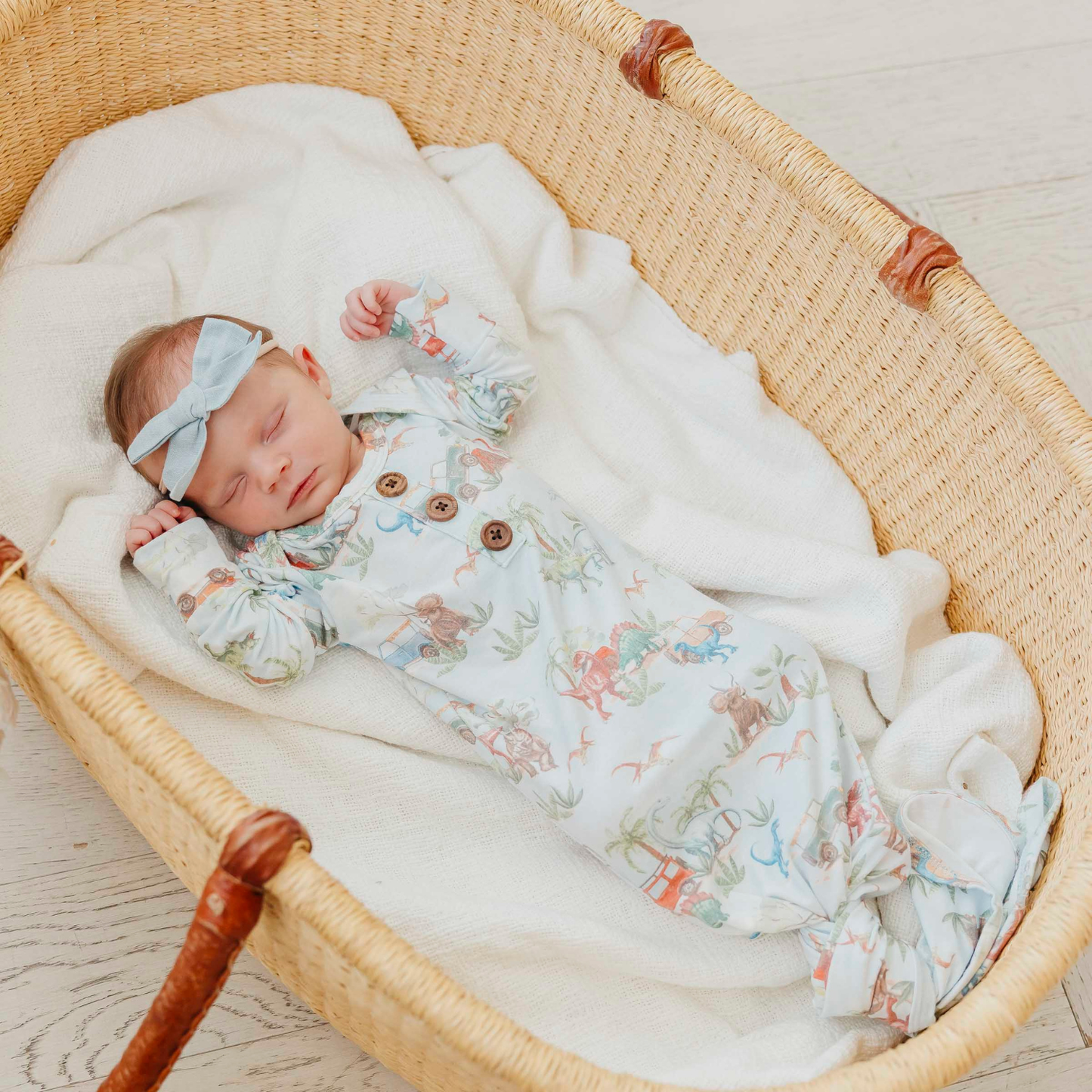 Dinosaur print baby gown with knotted bottom