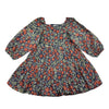 A vintage-style long-sleeve dress with a dense floral and vine pattern in red, orange, green, and cream on a dark navy background.