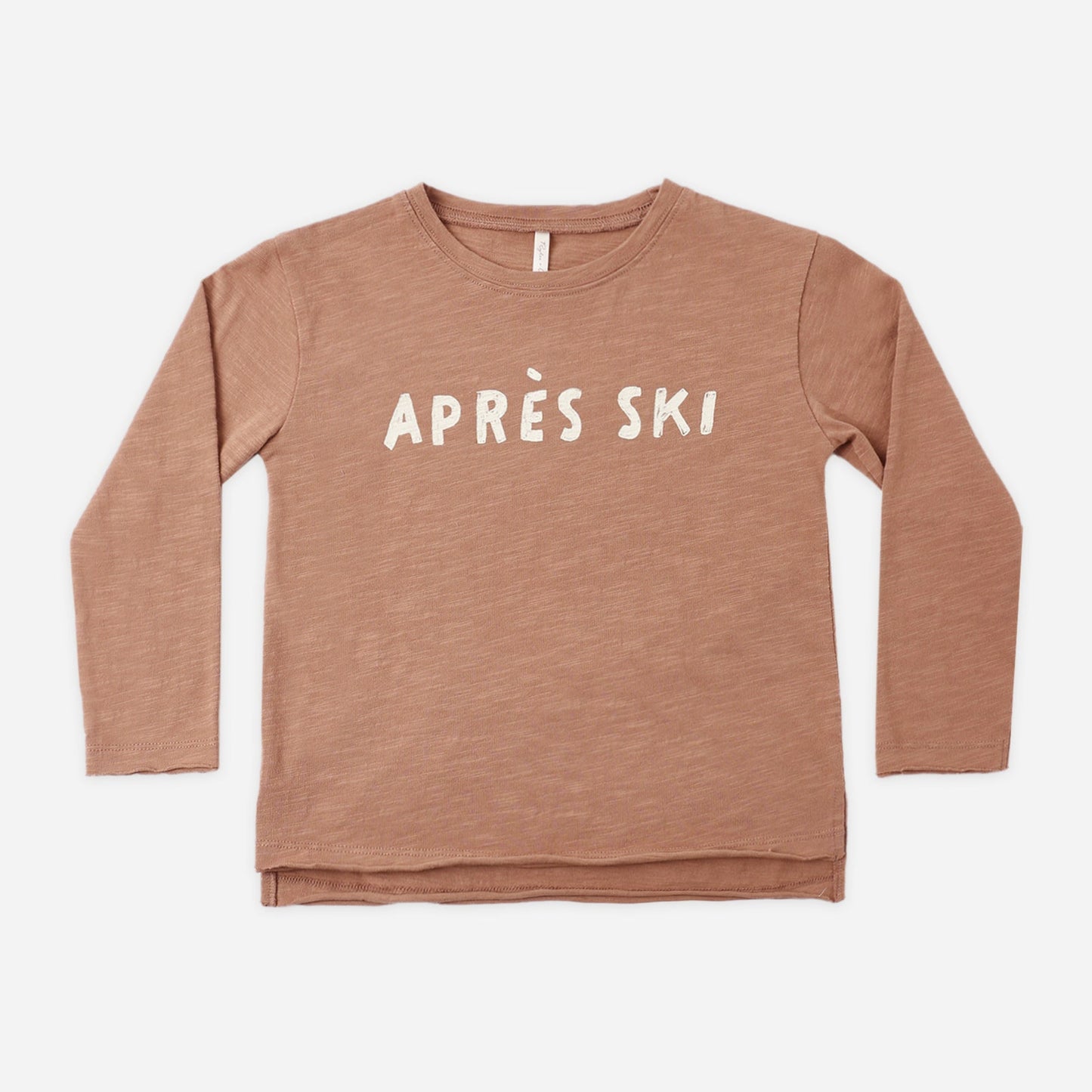 Boy wearing the Apres Ski Raw Edge Top, a clay-colored long sleeve tee with a spot print