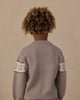 Child playing outdoors in the Apres Ski Reagan Sweater