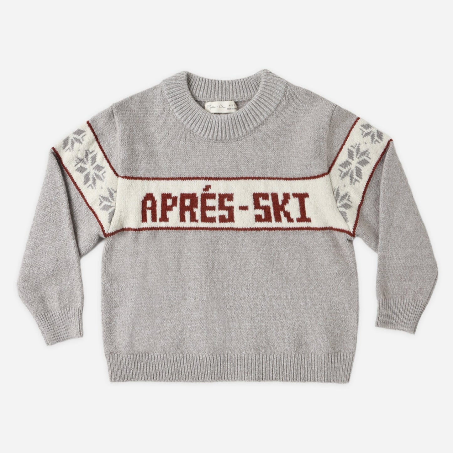 Child wearing the Apres Ski Reagan Sweater with a dusty blue fair isle pattern