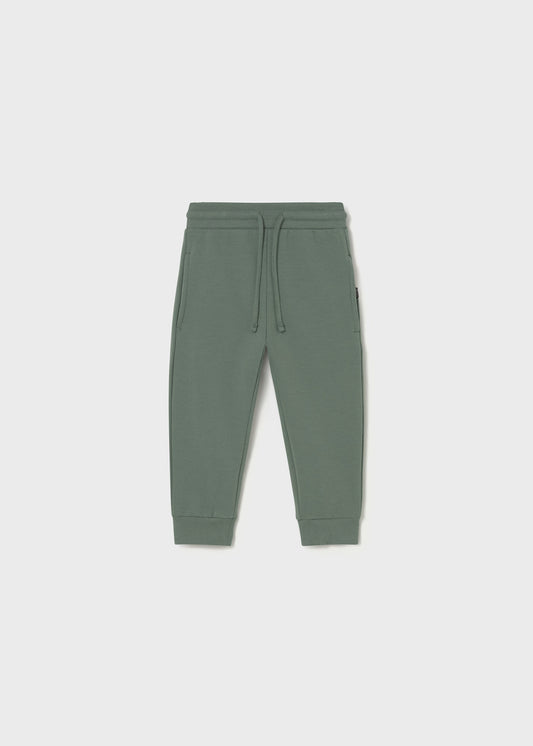 Green sweatpants on a white background
