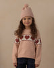 Child wearing the blush knit beanie