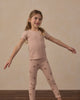 Child wearing the Blush Ribbed Basic Tee outdoors