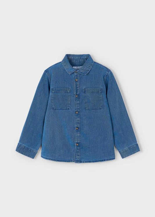 Blue denim shirt on a light gray background