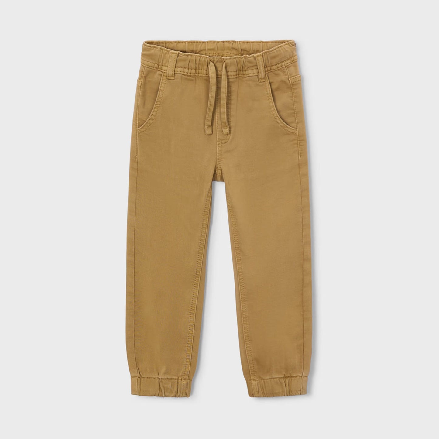 Tan jogger pants on a light beige background