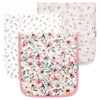 Three baby burp cloths with floral and animal prints on a white background