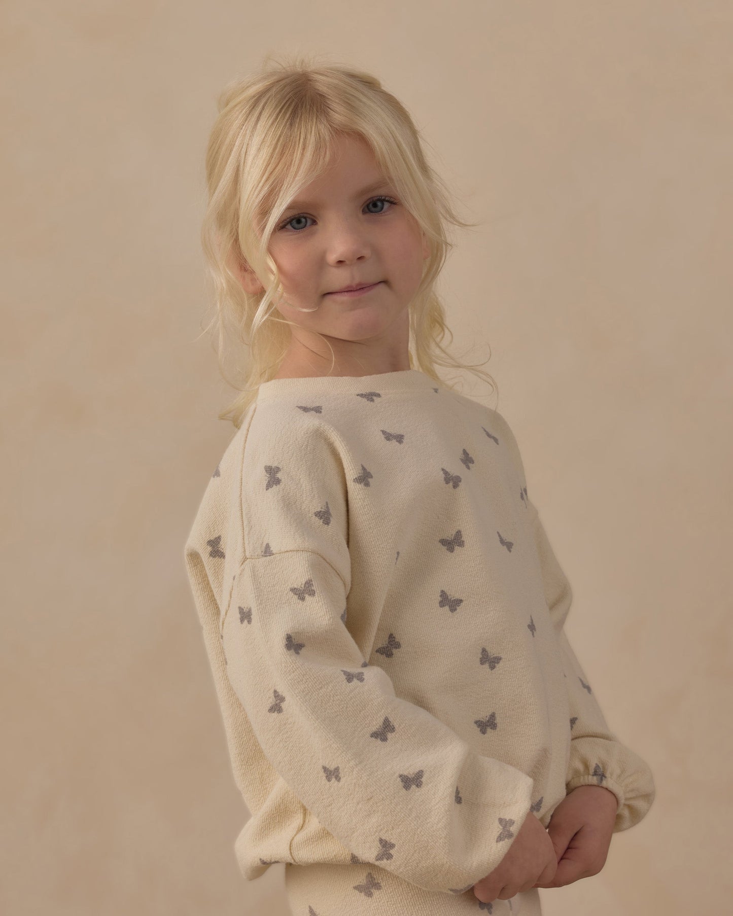 Close up of the butterfly ditsy print on the spongey knit set