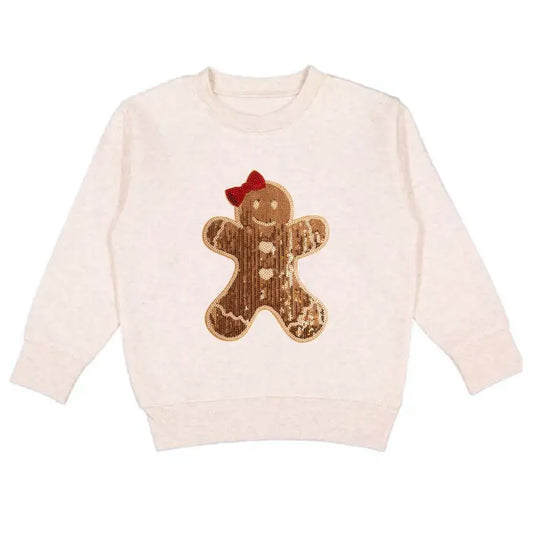 Beige sweater with a gingerbread man patch on a white background