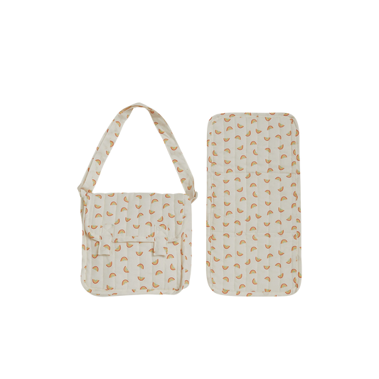 Toy changing pad with carrying case with a pattern on a white background