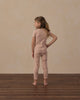 Girl standing in the blush Clay Stars Ruffle Sweatshirt