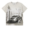 T-shirt with a graphic of a car and people on a city street, brand 'Molo' visible.