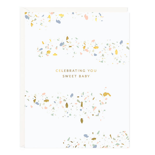 New baby card with a soft pastel confetti pattern, gold foil accent