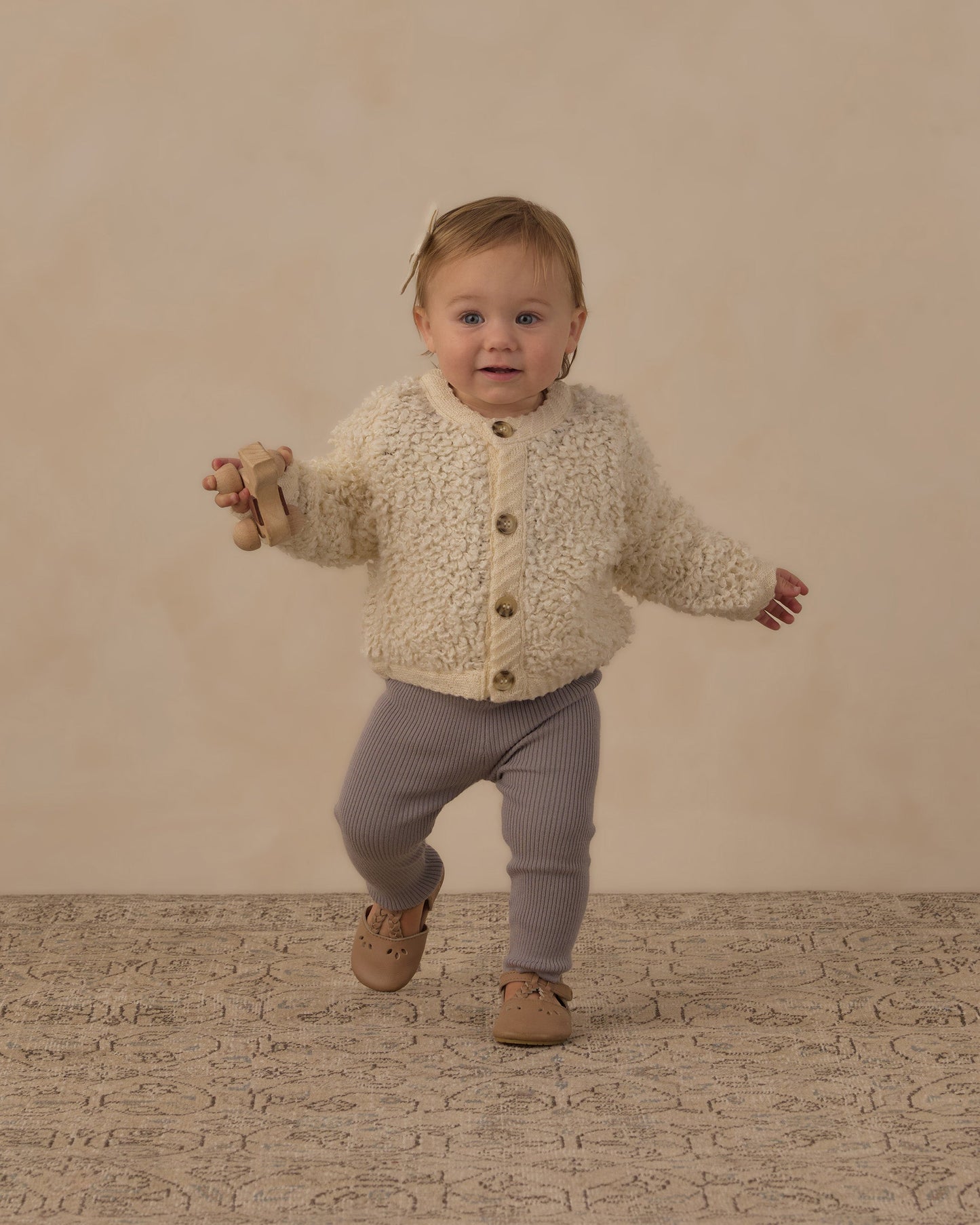 Child wearing the Dusty Blue leggings outdoors