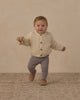 Baby wearing the dusty blue leggings