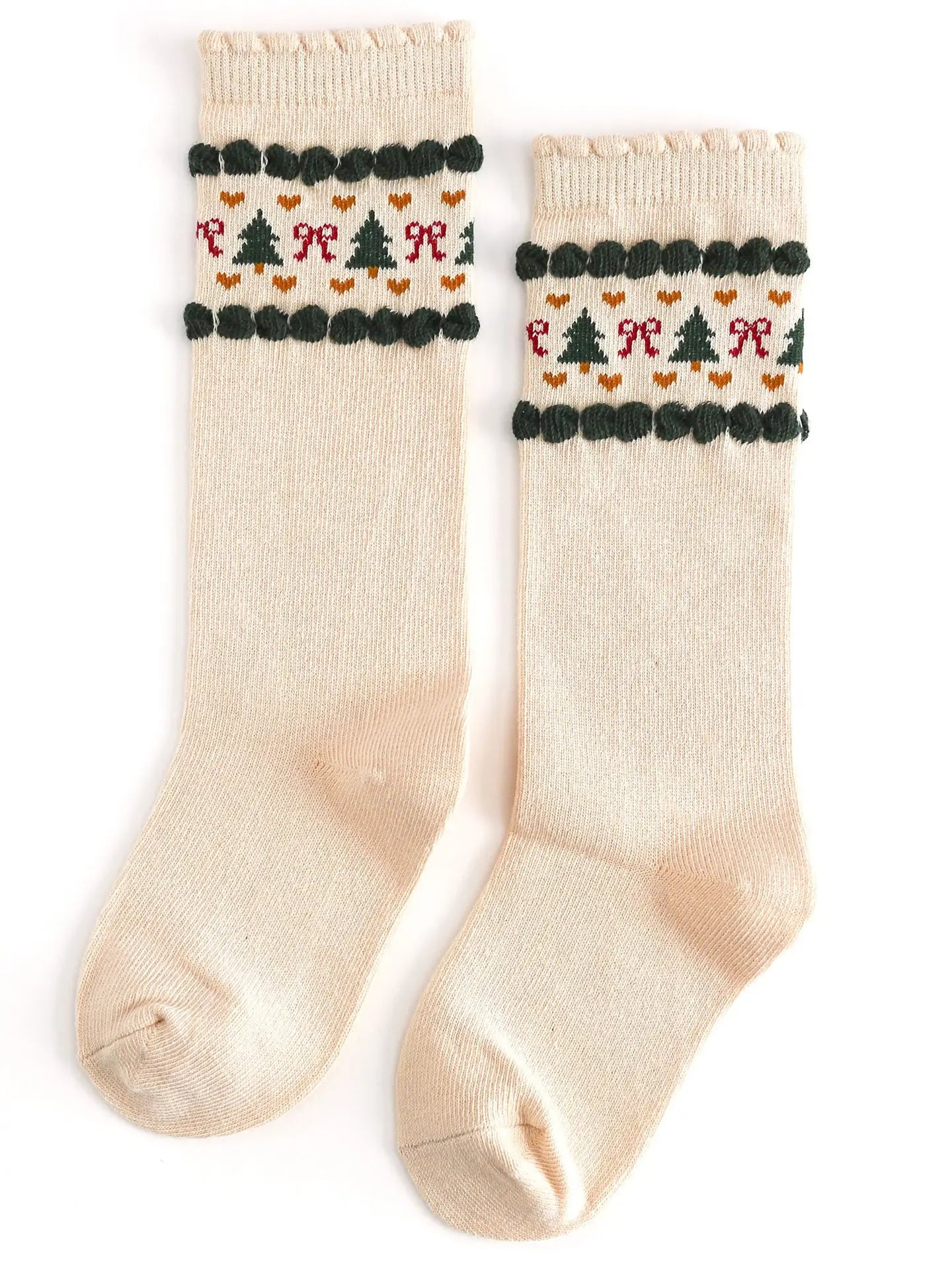 Pair of cream socks with festive pattern on a white background