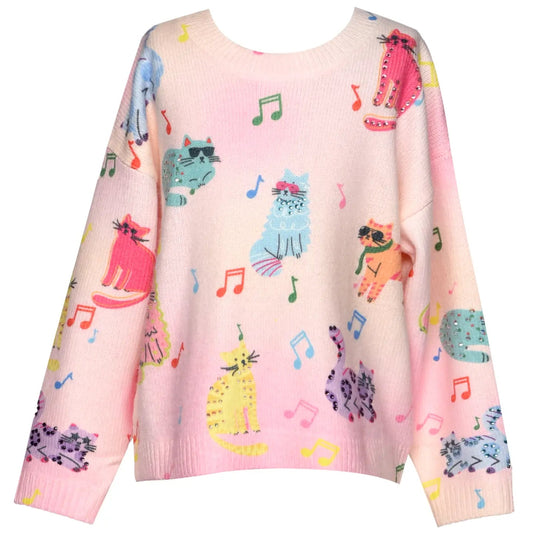 Pink sweater with colorful cat and music note pattern on a white background