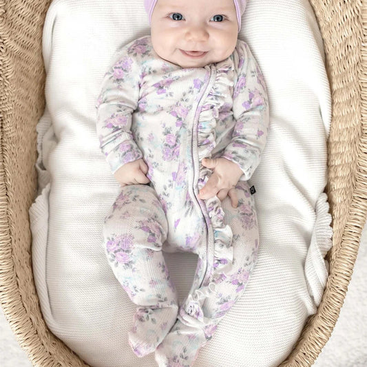 Long sleeve ruffle zip footie with purple flower all over print