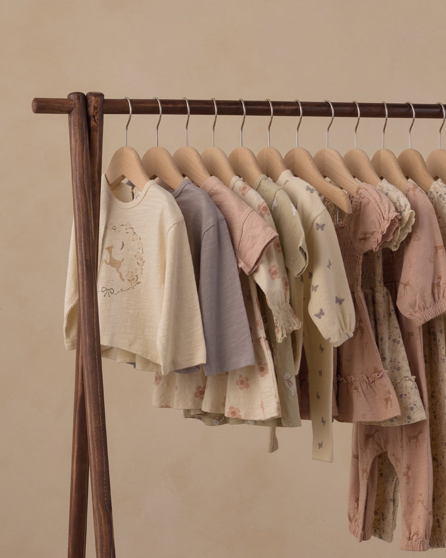 Flat lay of the Fawn Luna long sleeve top in natural fawn print