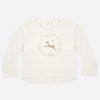 Girl wearing the Fawn Luna long sleeve top with a playful fawn spot print