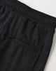 Flat lay of the Heather Black Tech Jogger showing the elastic waistband and tapered ankle