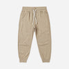 Child wearing the Heather Olive Tech Jogger, a relaxed fit olive jogger