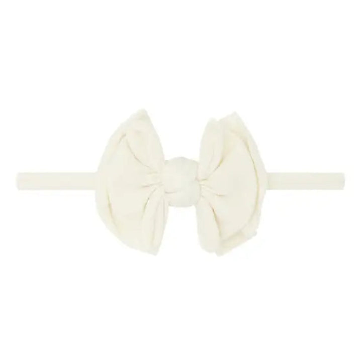 Ivory colored headband with bow in center