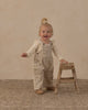 Baby wearing the leopard wide leg overalls