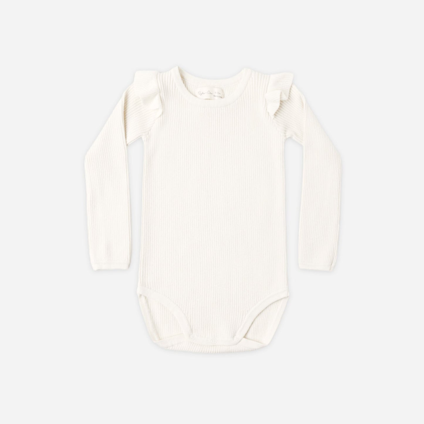Natural ruffle shoulder bodysuit by Rylee and Cru laid flat