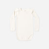 Natural ruffle shoulder bodysuit by Rylee and Cru laid flat