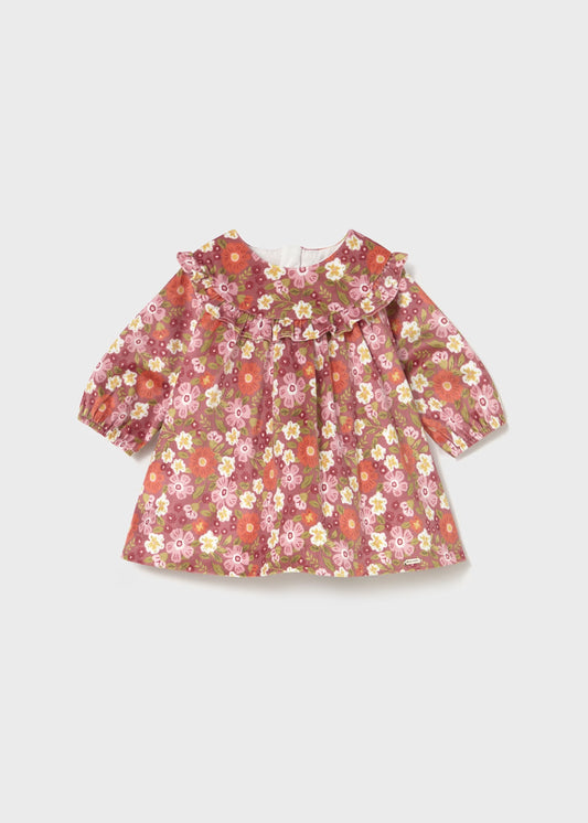 Floral dress with long sleeves on a light gray background
