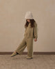 Close-up of lace trim detail on the olive sweatpant
