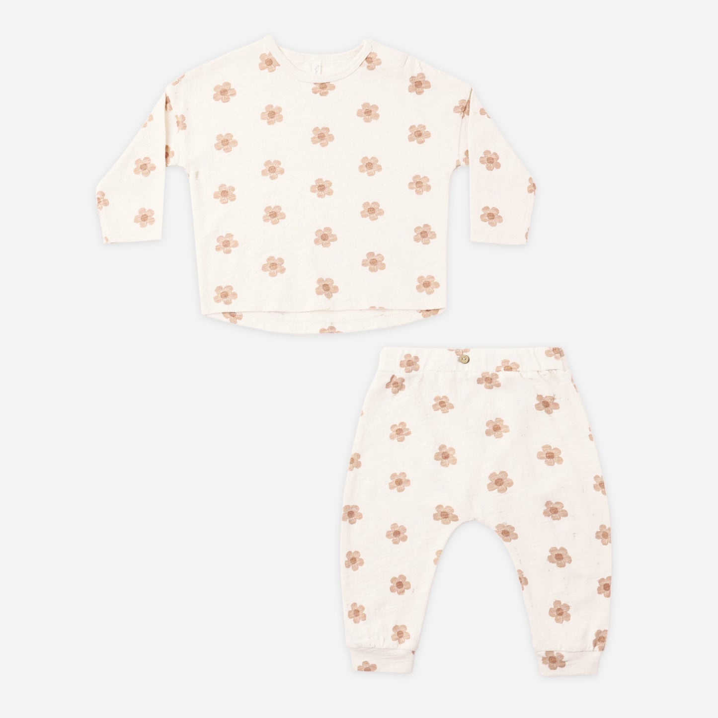 Pink daisies tee and pant set laid flat showing the full print