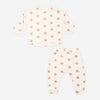 Pink daisies tee and pant set laid flat showing the full print