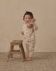 Baby wearing the pink daisies long sleeve tee and pant set by Rylee and Cru